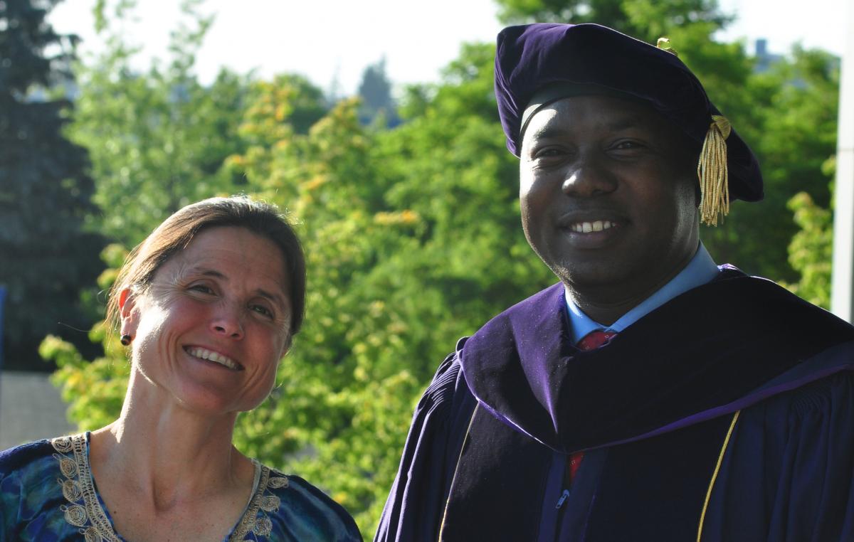 Photo of PhD grad Peter Cherutich and his mentor, Carey Farqhuar. 